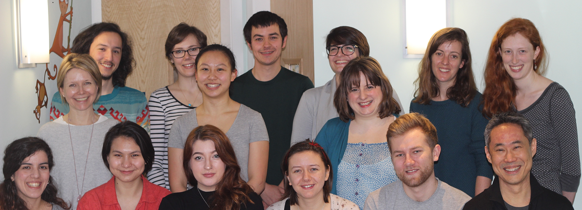 Image of former students in the lab